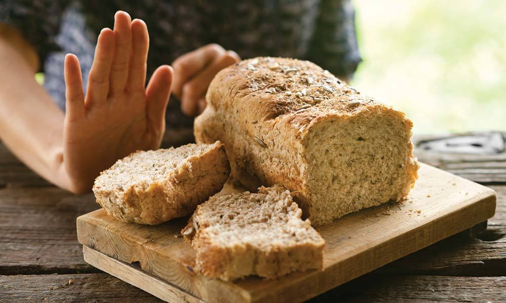 Woman Refusing Bread Gluten Celiac Disease